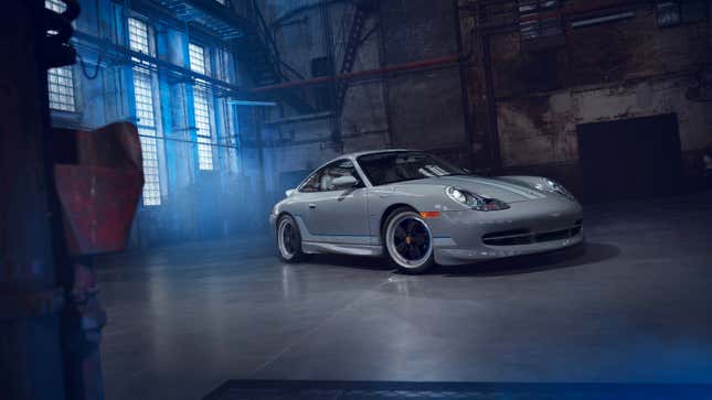 The Porsche 996-generation 911 Classic Club Coupe is parked in a warehouse looking menacing.