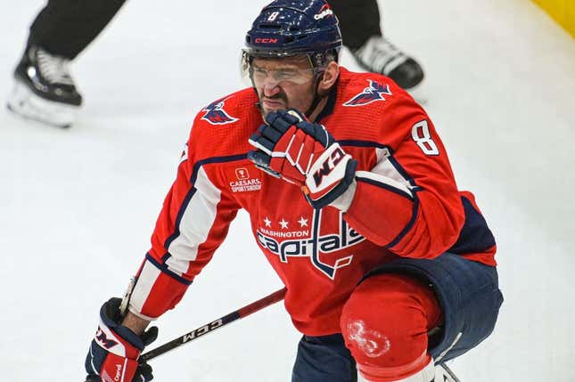 Apr 2, 2023; Washington, District of Columbia, USA;  Washington Capitals left wing Alex Ovechkin (8) reacts after being hit in the face by New York Rangers center Barclay Goodrow (not pictured) during the third period at Capital One Arena.
