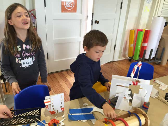 Seven-year-old Kate Stabenow and her five-year old brother Jack put the finishing touches on the buildings they designed and built at the Bay Area Discovery Museum’s new early-childhood fab lab.
