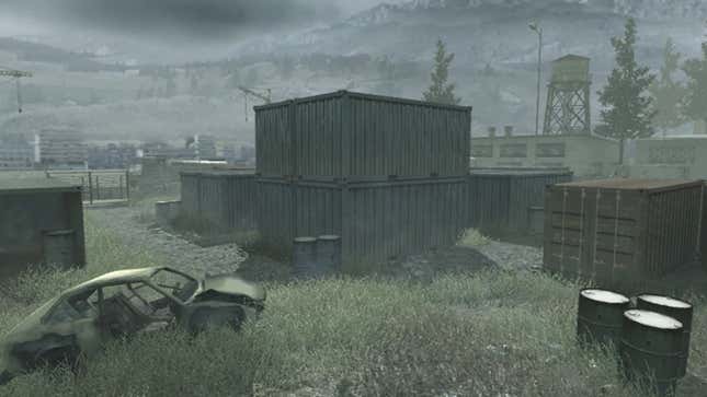 A picture of the original Shipment map from Call of Duty: Modern Warfare that shows shipping containers, oil drums, and a burnt-out car. 