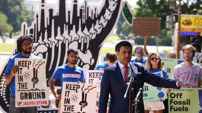 Rep. Ro Khanna speaks at an “End Fossil Fuel” rally near the U.S. Capitol on June 29, 2021 in Washington, DC, with protestors holding signs in the background with slogans such as "Keep It in the Ground" and "Off Fossil Fuels."