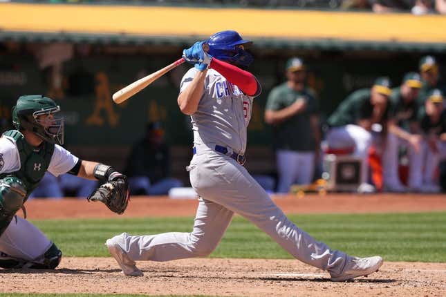 Apr 19, 2023; Oakland, California, USA; Chicago Cubs first baseman Eric Hosmer (51) hits a home run against the Oakland Athletics during the eighth inning at Oakland-Alameda County Coliseum.