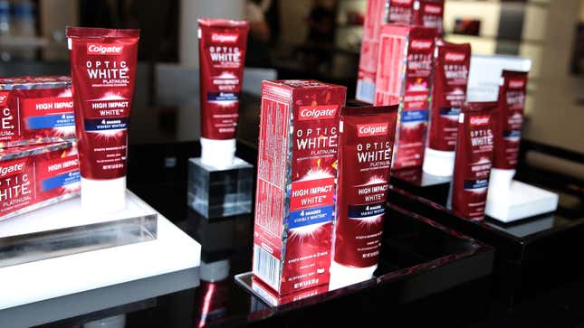 An assortment of Colgate toothpastes on a table.
