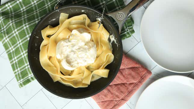 Papardelle with a perfect storm of truffle cheese sauce and burrata, truffle oil, and truffle salt.