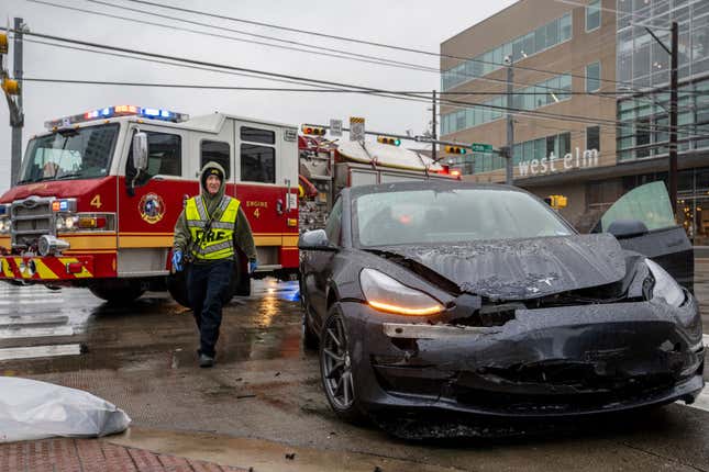A first responder attends to a collision on February 01, 2023 in Austin, Texas. A winter storm is sweeping across portions of Texas, causing massive power outages and disruptions of highways and roads.