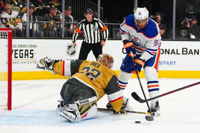 Mar 28, 2023; Las Vegas, Nevada, USA; Vegas Golden Knights goaltender Jonathan Quick (32) makes a save against \Edmonton Oilers left wing Evander Kane (91) during the first period at T-Mobile Arena.