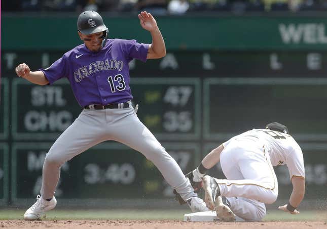 May 10, 2023; Pittsburgh, Pennsylvania, USA; Colorado Rockies second baseman Alan Trejo (13) is safe after stealing second base as Pittsburgh Pirates shortstop Chris Owings (right) attempts a tag during the fourth inning at PNC Park.