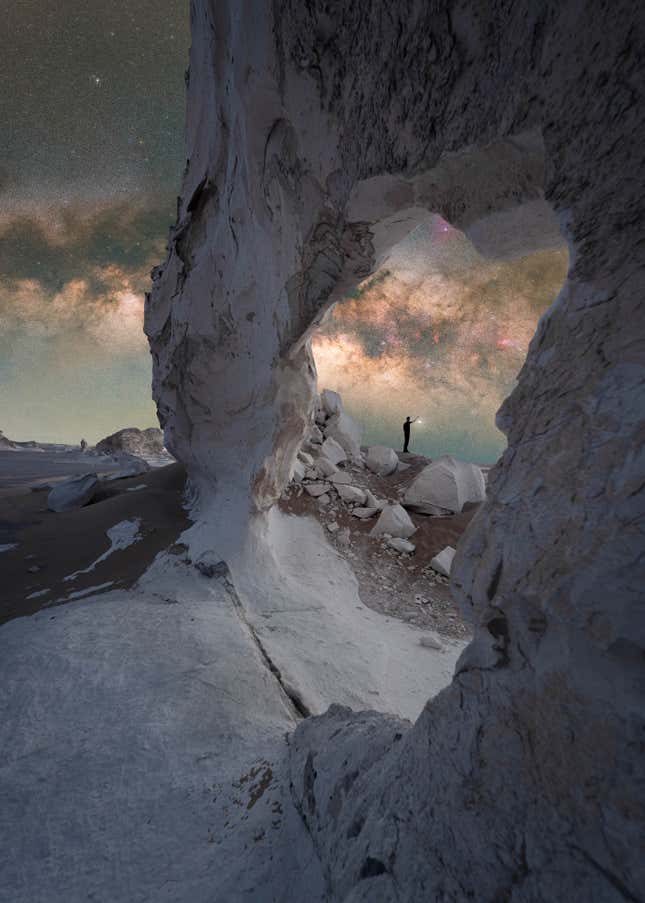 A white stone arch, the Milky Way in the background.