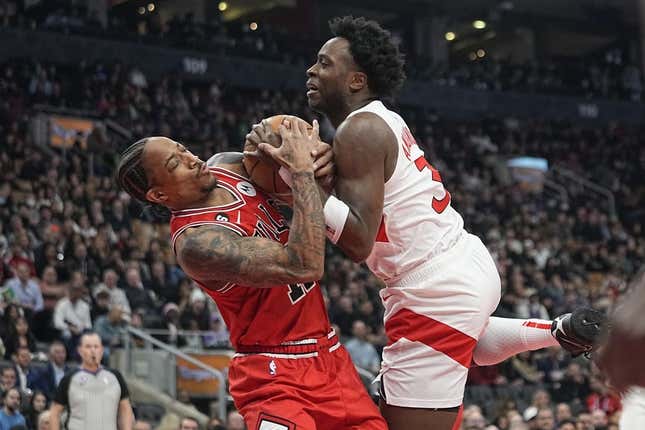 Feb 28, 2023; Toronto, Ontario, CAN; Chicago Bulls forward DeMar DeRozan (11) and Toronto Raptors forward O.G. Anunoby (3) battle for the ball during the first half at Scotiabank Arena.