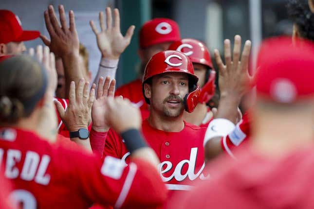 May 24, 2023; Cincinnati, Ohio, USA; Cincinnati Reds first baseman Spencer Steer (7) high fives teammates after scoring on a two-run single hit by catcher Tyler Stephenson (not pictured) in the first inning against the St. Louis Cardinals at Great American Ball Park.