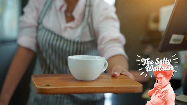 server handing customer cup of coffee on wooden board