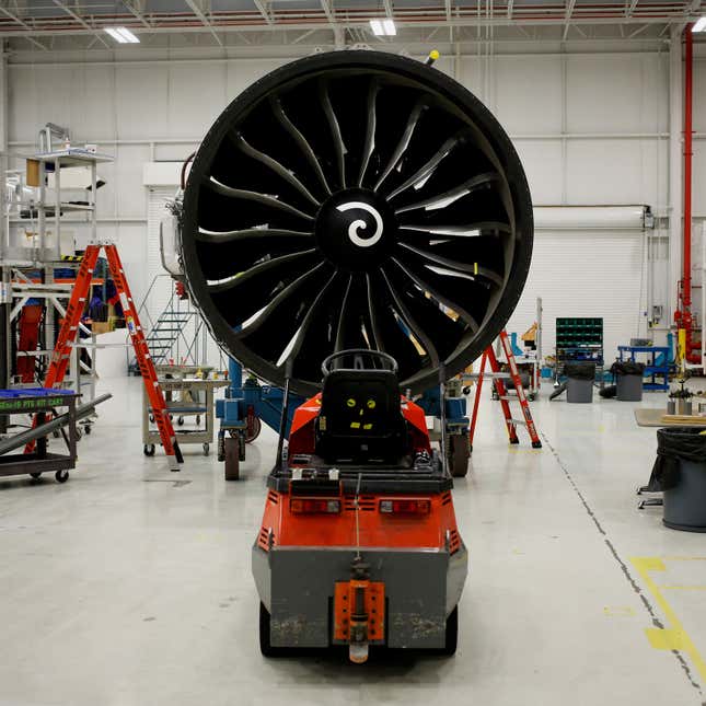 A photo of a CFM56 plane engine in a workshop. 