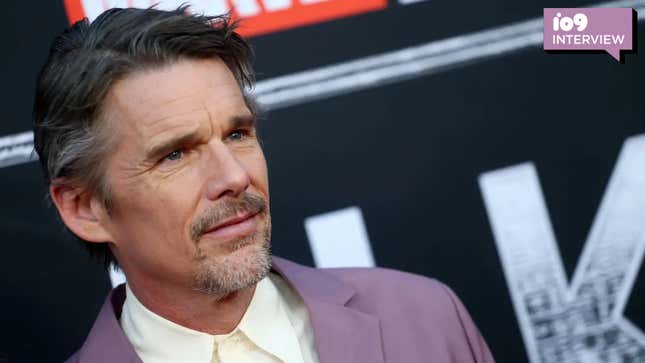 Ethan Hawke wears a purple suit at the Moon Knight premiere in Los Angeles.