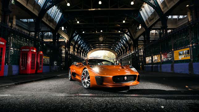 A Jaguar C-X75 concept car in orange in a tunnel in London