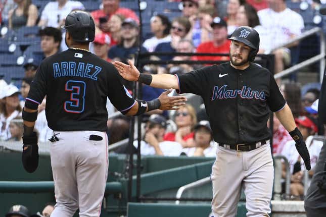 Jun 17, 2023; Washington, District of Columbia, USA; Miami Marlins shortstop Garrett Hampson (1) and second baseman Luis Arraez (3) celebrate after scoring against the Washington Nationals during the ninth inning at Nationals Park.