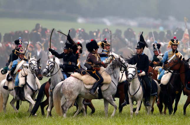 Performers take part in the re-enactment of "The Allied Counterattack " battle as part of the bicentennial celebrations for the Battle of Waterloo