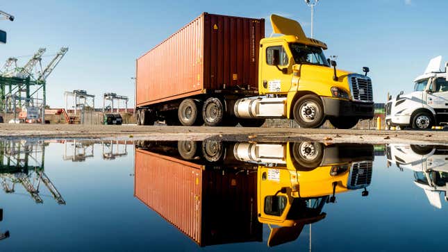     trucks departing from the Port of Oakland transit terminal on November 10, 2021, in Oakland, Calif.