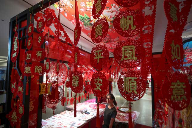 A Malaysian store displays Lunar New Year decorations at a shopping mall in Kuala Lumpur, Malaysia, Monday, Jan. 16, 2017. The Lunar New Year which falls on Jan. 28 this year marks the Year of the Rooster in the Chinese calendar. (AP Photo/Vincent Thian)