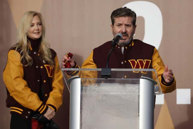 Feb 2, 2022; Landover, MD, USA; Washington Commanders co-owner Dan Snyder speaks as co-owner Tanya Snyder (L) listens during a press conference revealing the Commanders as the new name for the formerly named Washington Football Team at FedEx Field.