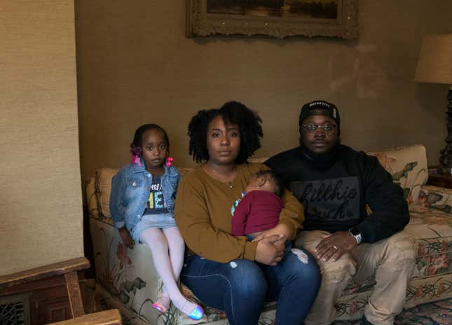 Ra (center) with her 4-year-old daughter, Zala, her 10-month-old son, Zakai, and her husband, Kamal Muhammad, on March 24.