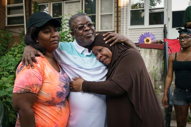 Delores Crosland, left, her uncle Curtis Crosland, center, and his sister Shirley Crosland, right, hug after Curtis was released from prison for a crime he did not commit, in the Cobbs Creek neighborhood of Philadelphia, June 24, 2021.