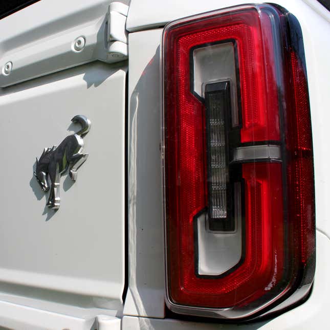 A photo of the horse logo on the rear of a Ford Bronco. 
