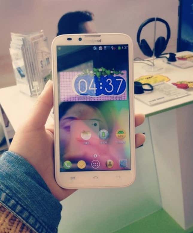 A blogger from Nanjing, China shows off her Coolpad smartphone.
