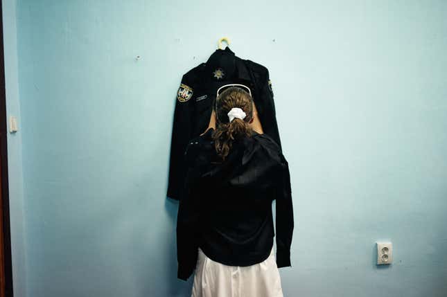 A female cadet getting ready to graduate.