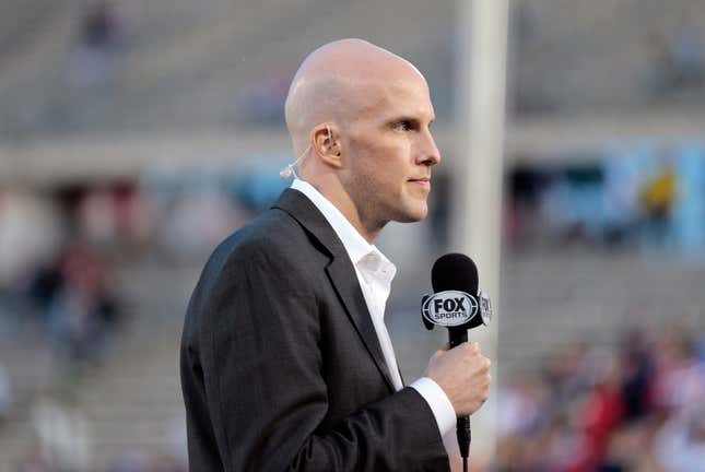 Longtime soccer reporter Grant Wahl reporting from a USMNT match in 2014.