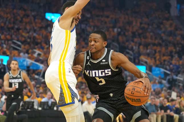 Apr 23, 2023; San Francisco, California, USA; Sacramento Kings guard De&#39;Aaron Fox (5) dribbles against Golden State Warriors guard Jordan Poole (left) during the first quarter of game four of the 2023 NBA playoffs at Chase Center.