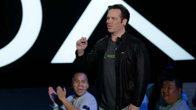 Phil Spencer is standing on stage with Xbox fans cheering behind him.