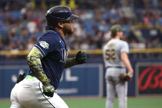 May 20, 2023; St. Petersburg, Florida, USA;Tampa Bay Rays designated hitter Harold Ramirez (43) hits a home run as Milwaukee Brewers starting pitcher Eric Lauer (52) looks on during the first inning  at Tropicana Field.