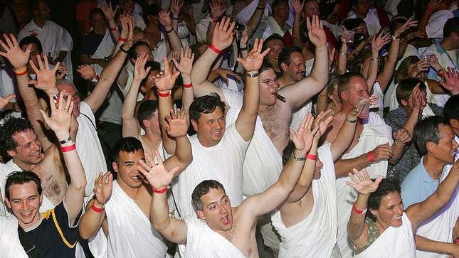 Adults wearing togas at party