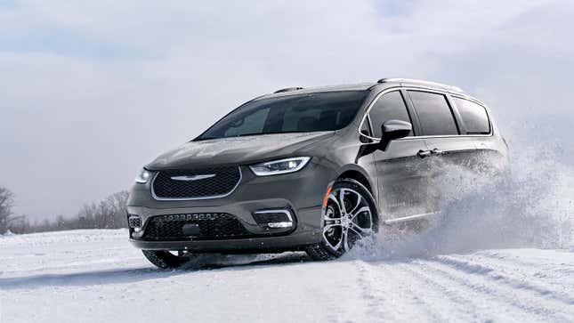 A photo of a Chrysler minivan driving in snow. 