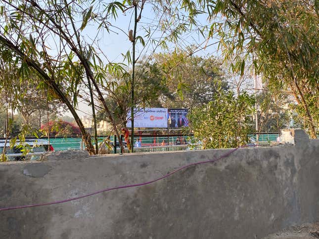 The wall in Ahmedabad that hides the slum dwellings in Saraniya Vaas.