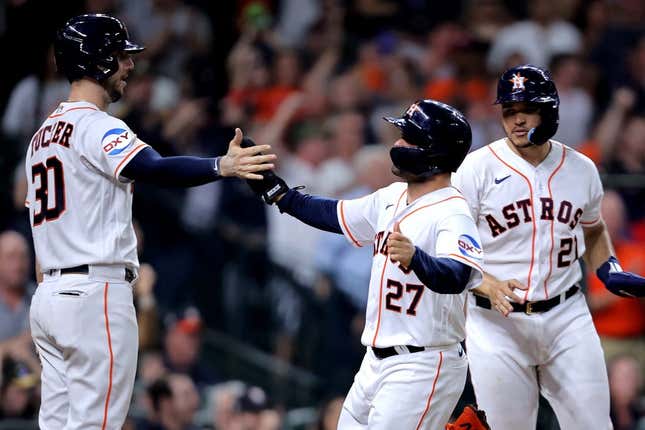 Jun 1, 2023; Houston, Texas, USA; Houston Astros second baseman Jose Altuve (27) is greeted by Houston Astros right fielder Kyle Tucker (30) after scoring a run against the Los Angeles Angels during the fifth inning at Minute Maid Park.