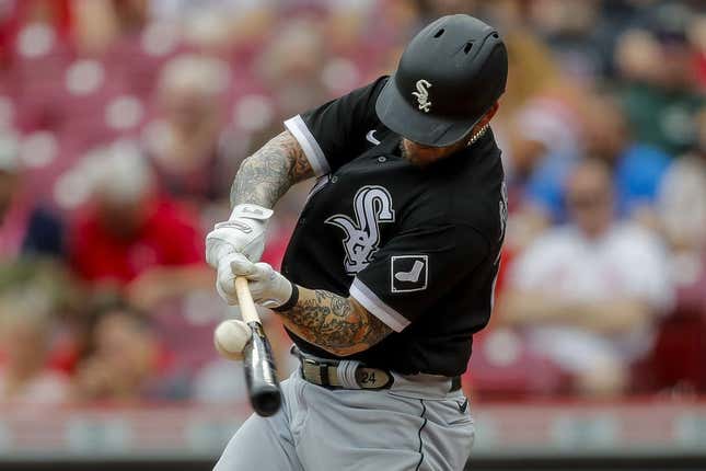 May 7, 2023; Cincinnati, Ohio, USA; Chicago White Sox designated hitter Yasmani Grandal (24) hits a single in the second inning against the Cincinnati Reds at Great American Ball Park.
