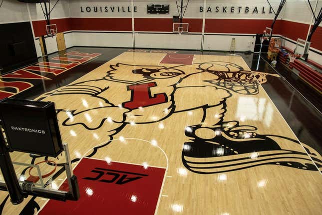 The new image of the cardinal mascot dunking has been completed on the floor of the U of L basketball practice facility on Floyd Street. May 15, 2019

T9i1136 Uofl Logo