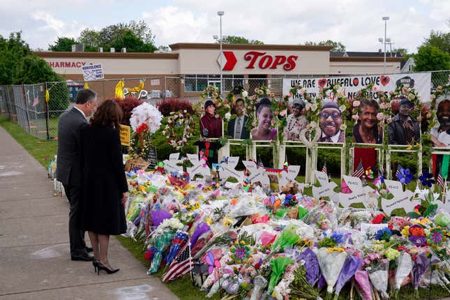 Vice President Kamala Harris and her husband Doug Emhoff visit a memorial near the site of the Buffalo supermarket shooting after attending a memorial service for Ruth Whitfield, one of the victims of the shooting, Saturday, May 28, 2022, in Buffalo, N.Y. 
