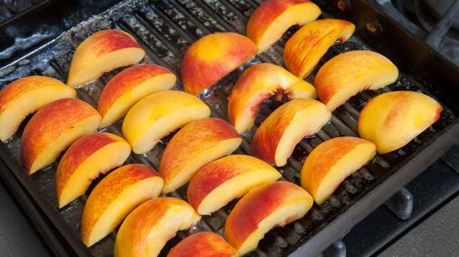 Peach slices on a grill