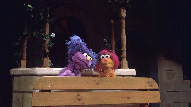 Israeli Muppet Daffy, left, visits Palestinian Muppet Haneen on the set of a Palestinian street during the taping of a joint Israeli-Palestinian production of Sesame Street in 1997.