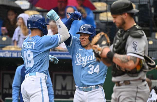 May 11, 2023; Kansas City, Missouri, USA;  Kansas City Royals second baseman Michael Massey (19) celebrates with catcher Freddy Fermin (34) after hitting a solo home run during the second inning against the Chicago White Sox at Kauffman Stadium.