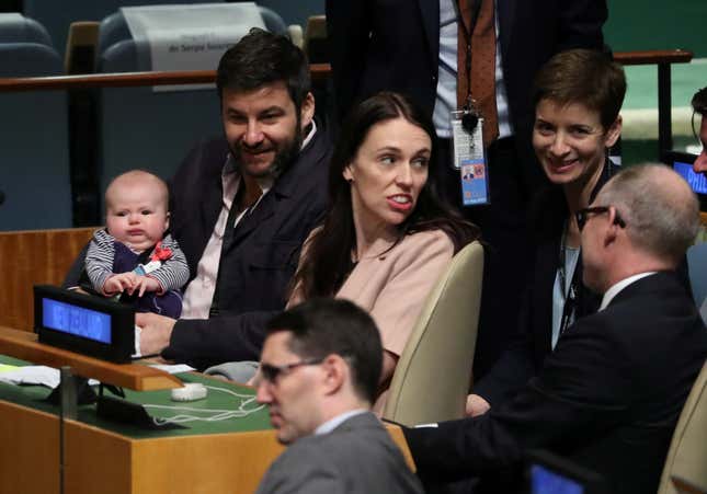 Ardern sits with partner Clarke Gayford and their daughter.