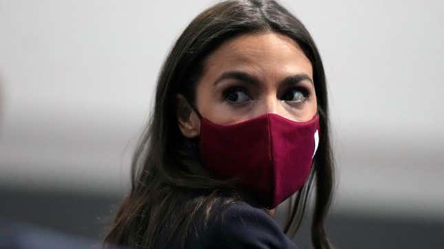 U.S. Rep. Alexandria Ocasio-Cortez looks round to listen to a question at the COP26 U.N. Climate Summit, in Glasgow, Scotland, Wednesday, Nov. 10, 2021. Ocasio-Cortez has tested positive for COVID-19 and “is experiencing symptoms and recovering at home,” her office said in a statement Sunday, Jan. 9, 2022.