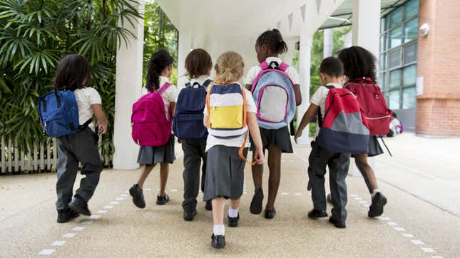 Kindergarteners going to nack to school with new backpacks.