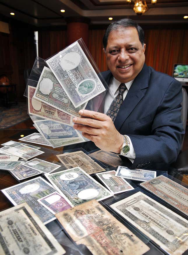 Rezwan Razack with some of the notes from his collection.