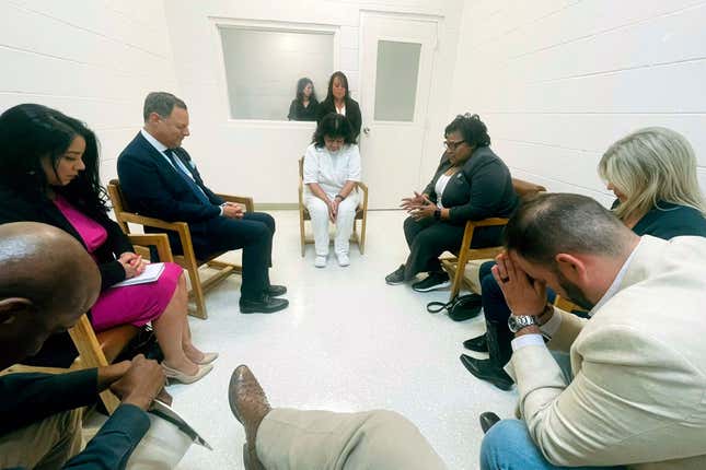 Lucio leads a group of Texas lawmakers visiting her in prayer ahead of her scheduled execution.