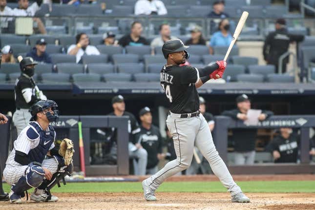 Jun 8, 2023; Bronx, New York, USA;  Chicago White Sox right fielder Eloy Jimenez (74) hits a two run home run in the seventh inning against the New York Yankees at Yankee Stadium.