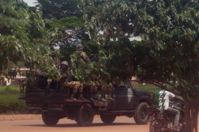 Members of the presidential guard look for protesters in Ouagadougou.