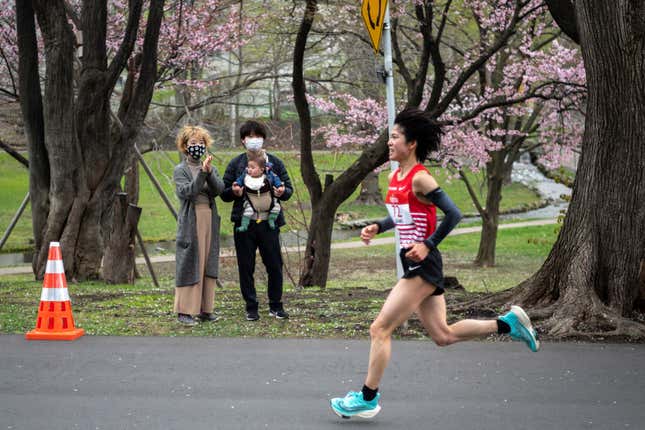 An athlete competes in the half-marathon race which doubles as a test event for the 2020 Tokyo Olympics, in Sapporo on May 5, 2021.